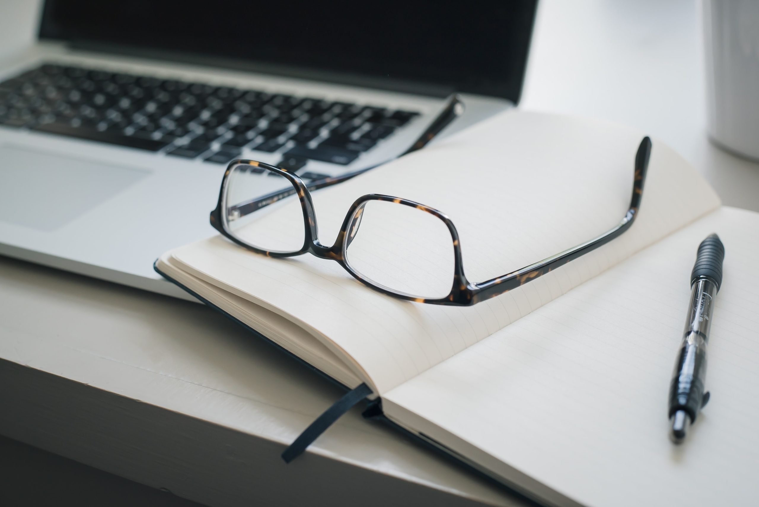 Effective note-taking with a notebook and pen for traditional note taking in a therapists office.